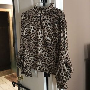 “Gracias” size L Leopard print blouse. Never worn.